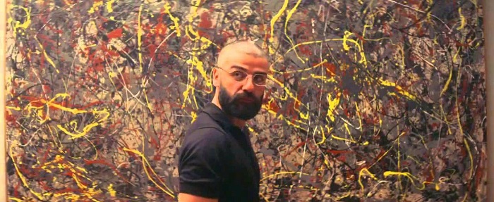 Nathan in front of what may or may not be a Jackson Pollock Painting