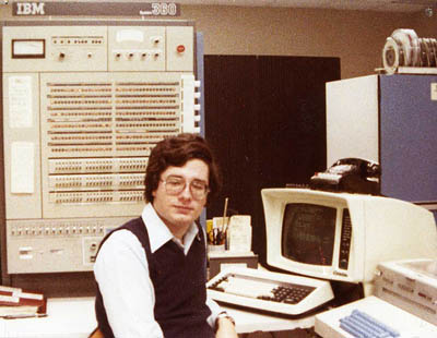 John Sloan, systems programmer, sitting in front of an IBM 360/65 mainframe at Wright State University circa 1978.